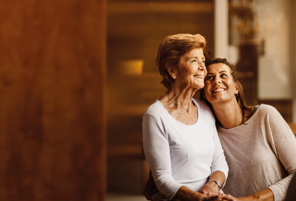 Smiling mother and daughter. Preparing for retirement with BPI Pension Savings Schemes.